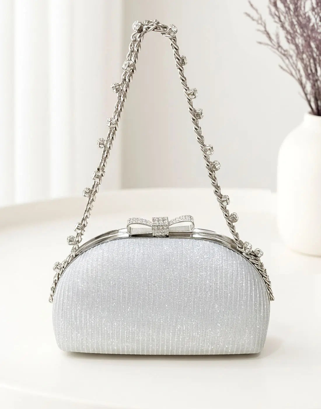 Glittering Bow Clasp Silver Clutch Bag