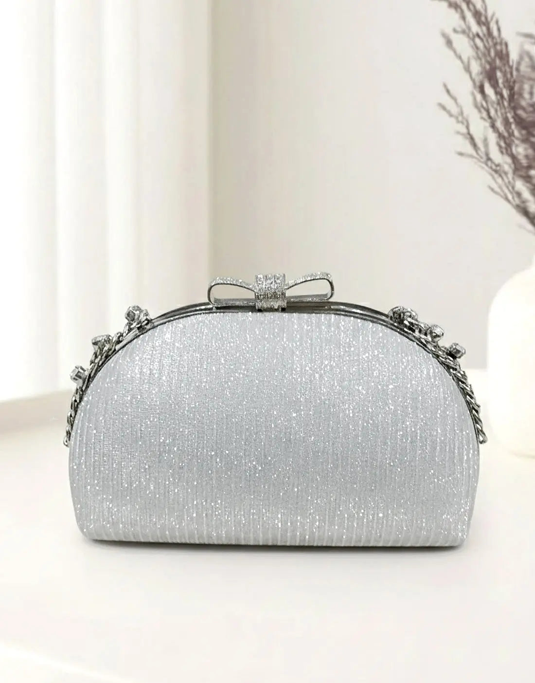 Glittering Bow Clasp Silver Clutch Bag